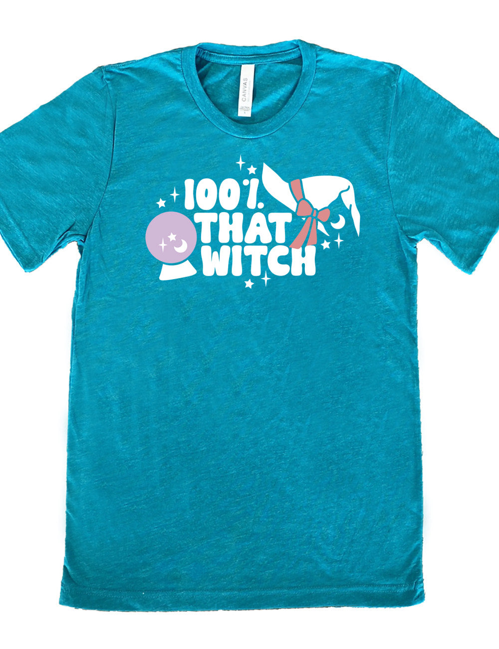 teal unisex tee with the words "100% that witch" next to the graphic of a witch hat with a bow, a crystal ball, and some stars