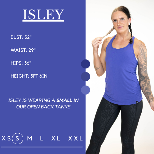 Model's measurements of 32 inch bust, 29 inch waist, 36 inch hips, and height of 5 foot 5 inches. She is wearing a size small in our open back tanks