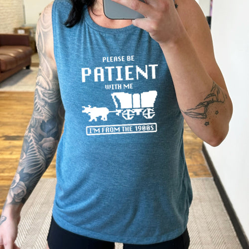 blue muscle tank with the saying "please be patient with me I'm from the 1900's"