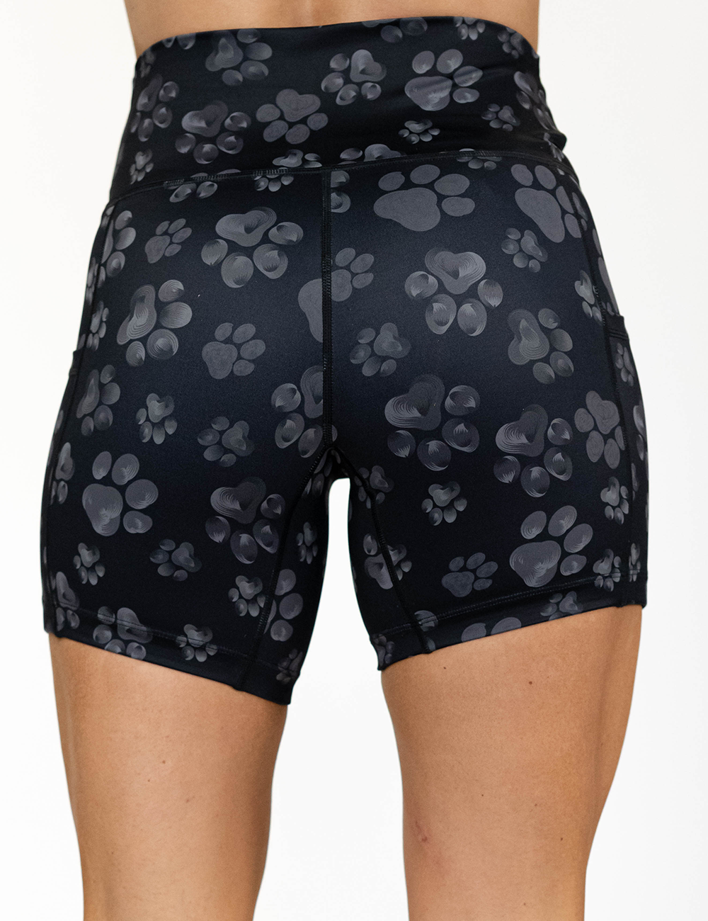 back of the 5 inch grey pawprints against a black background shorts