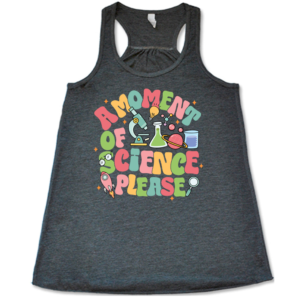 Grey colored flowy tank with laboratory items graphic on it that says "A Moment of Science Please"