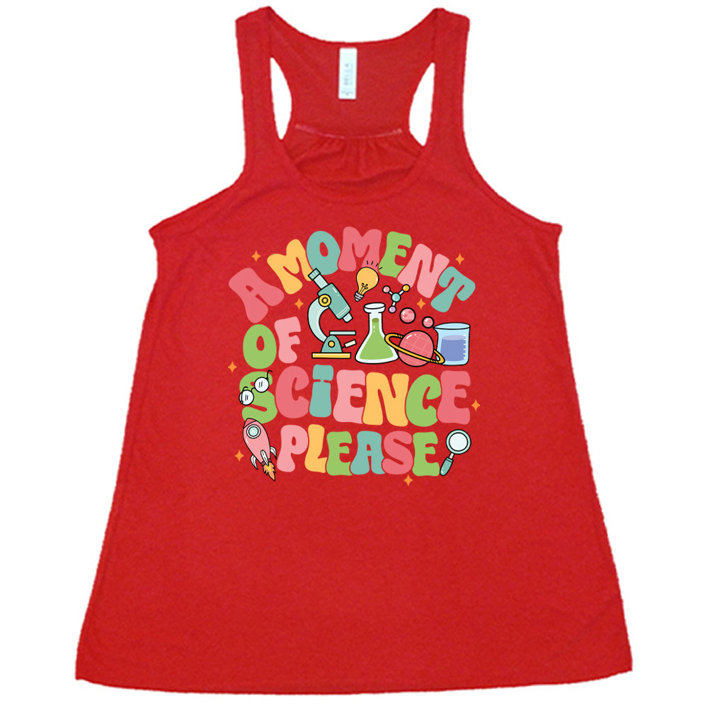Red colored flowy tank with laboratory items graphic on it that says "A Moment of Science Please"