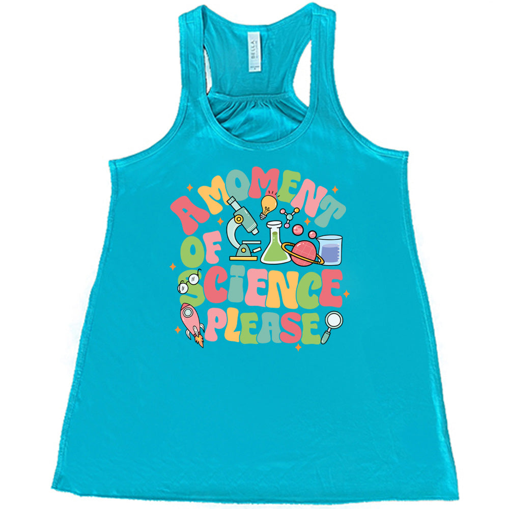 Teal colored flowy tank with laboratory items graphic on it that says "A Moment of Science Please"
