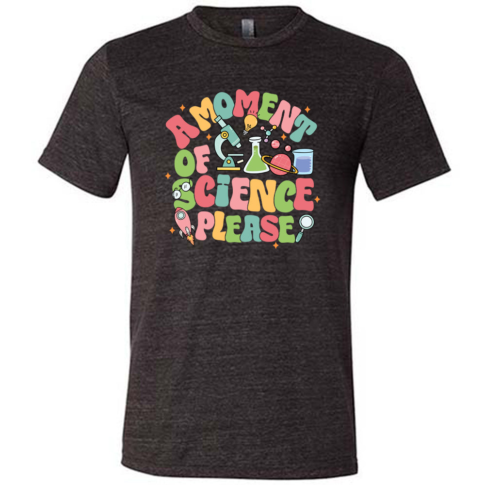 Black colored shirt with laboratory items graphic on it that says "A Moment of Science Please"