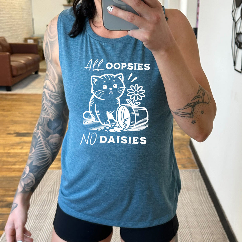 deep teal muscle tank with the text "All Oopsies, No Daisies" on it with the graphic of a concerned cat next to a flower pot that has cracked on the ground