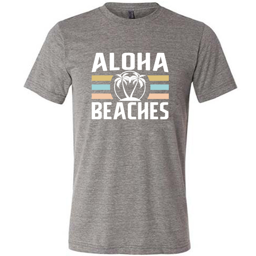 Grey colored shirt with a palm tree graphic on it that says "Aloha Beaches"