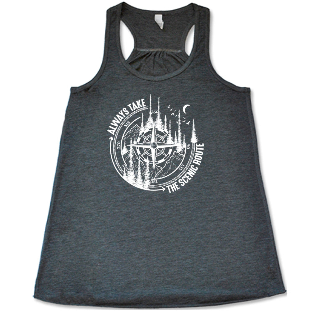 Grey colored flowy tank with a compass and forest graphic on it that says "Always Take The Scenic Route"