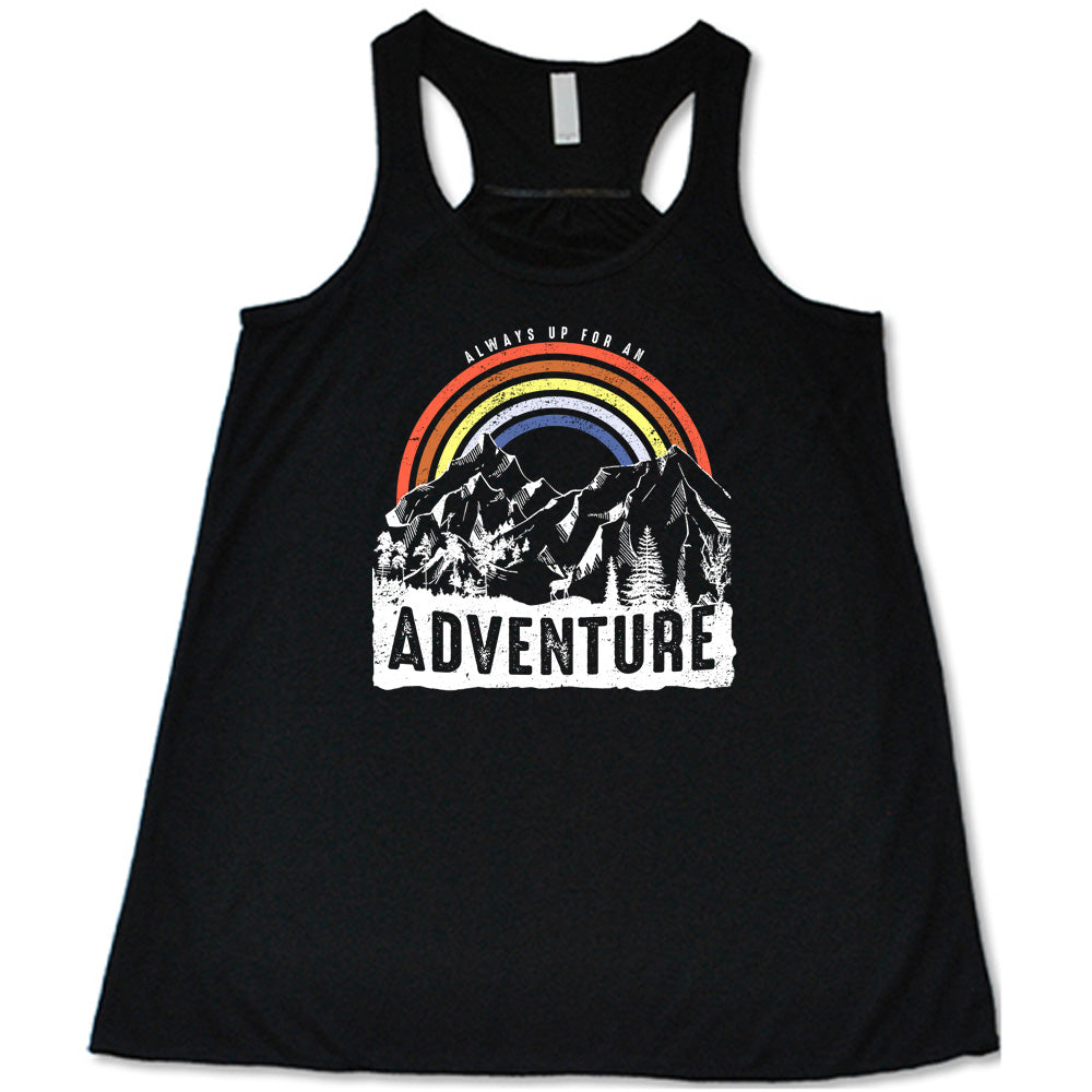 Black colored flowy tank with a rainbow over mountains graphic on it that says "Always Up For An Adventure"