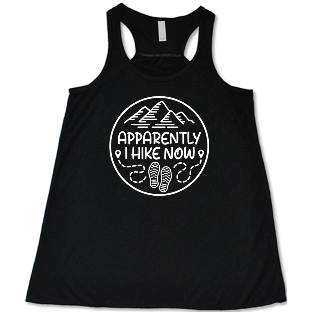 Black colored flowy tank with a mountain and shoes graphic on it that says "Apparently I Hike Now"