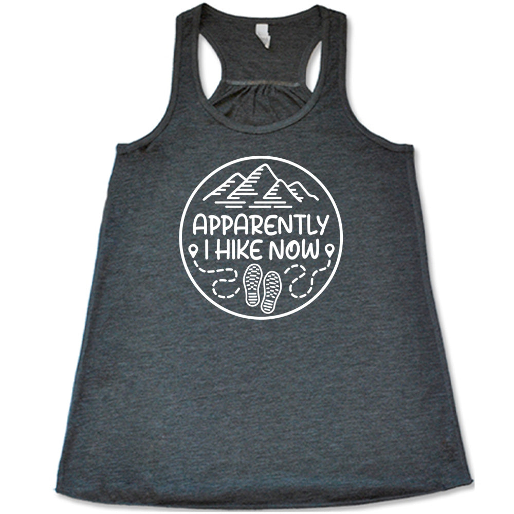 Grey colored flowy tank with a mountain and shoes graphic on it that says "Apparently I Hike Now"