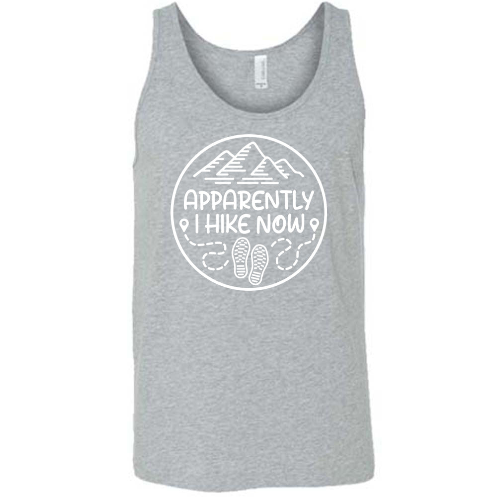 Grey colored tank with a mountain and shoes graphic on it that says "Apparently I Hike Now"