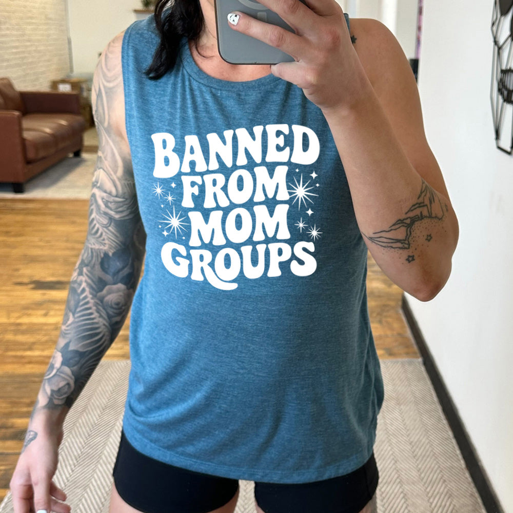 deep teal muscle tank with the words "banned from mom groups" on it, with stars on either side of the words "from mom"