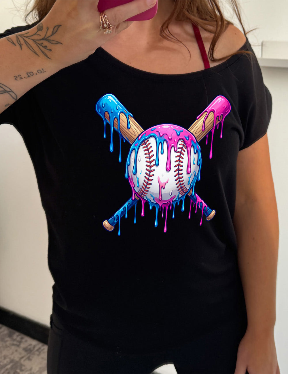 black slouchy tee with the graphic of a baseball with two bats crossed behind it, and all of it dripping with blue and pink