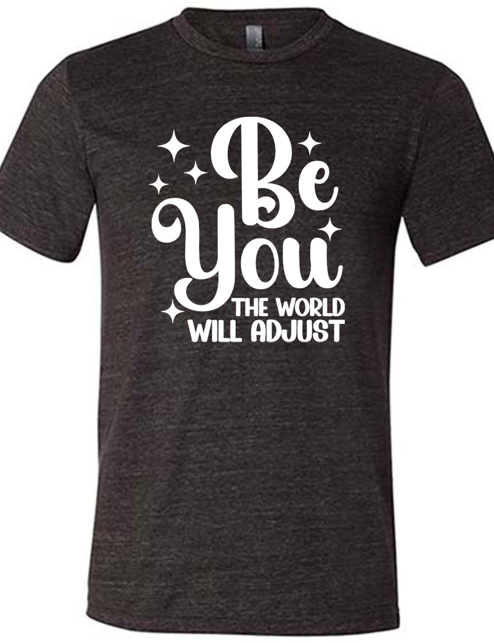 black unisex tee with the words "be you" in big letters, surrounded by a few little stars, followed by the words "the world will adjust" underneath