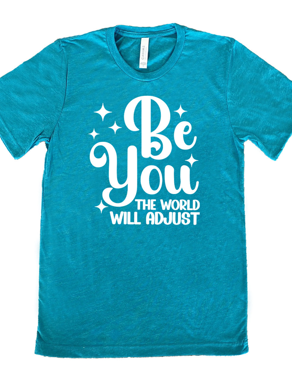 teal unisex tee with the words "be you" in big letters, surrounded by a few little stars, followed by the words "the world will adjust" underneath