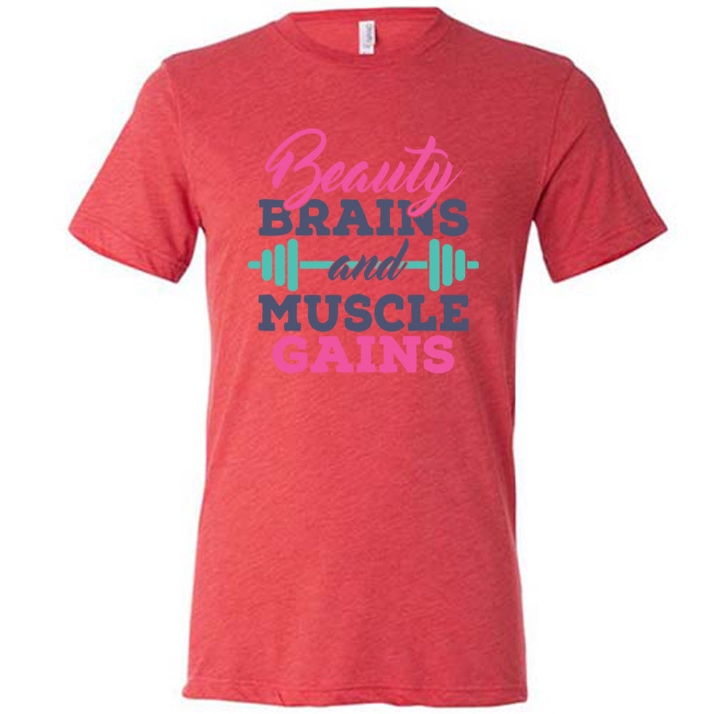 Red Unisex Tee, with wording Beauty Brains and Muscle Gains, multicolored lettering with a barbell