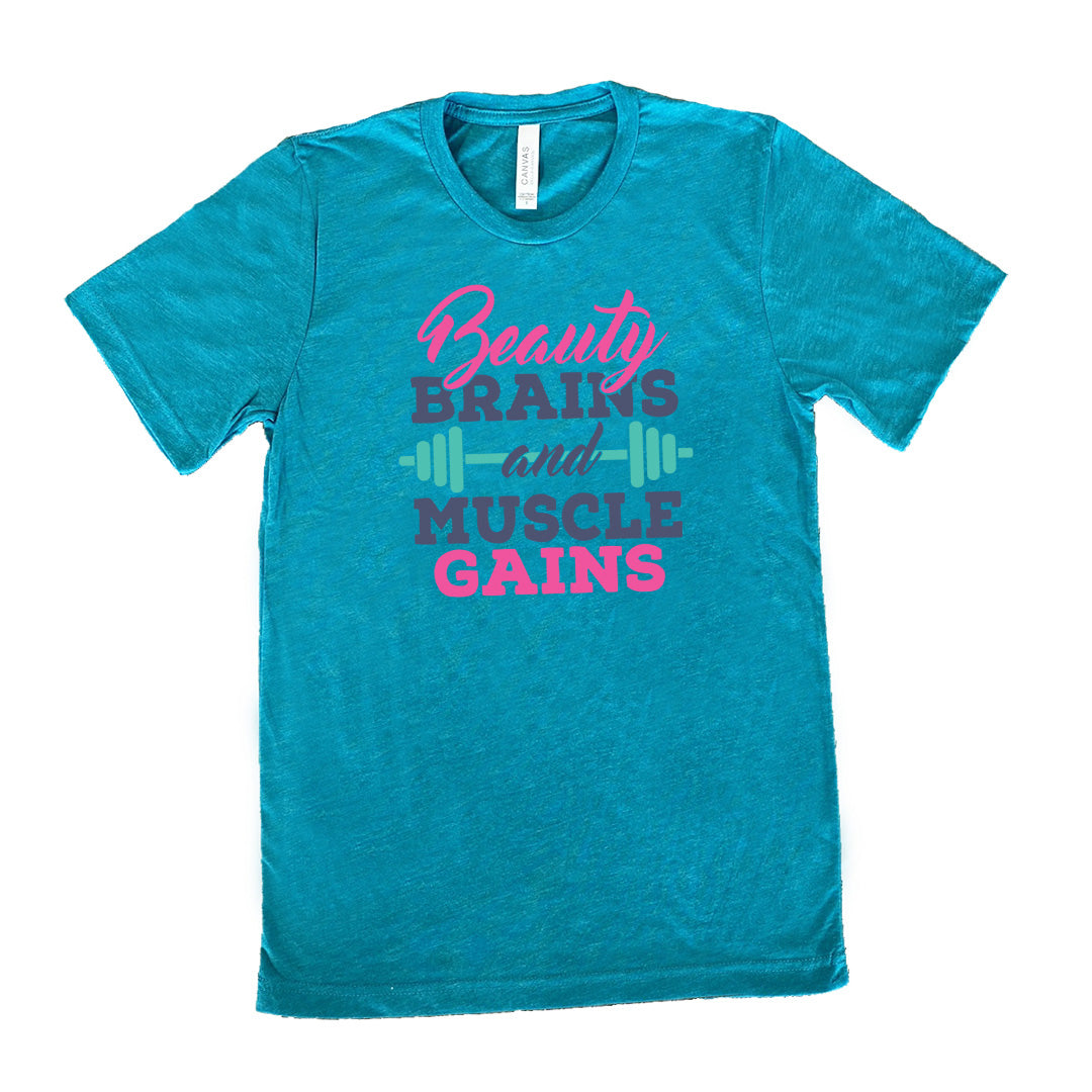 Teal Unisex Tee, with wording Beauty Brains and Muscle Gains, multicolored lettering with a barbell