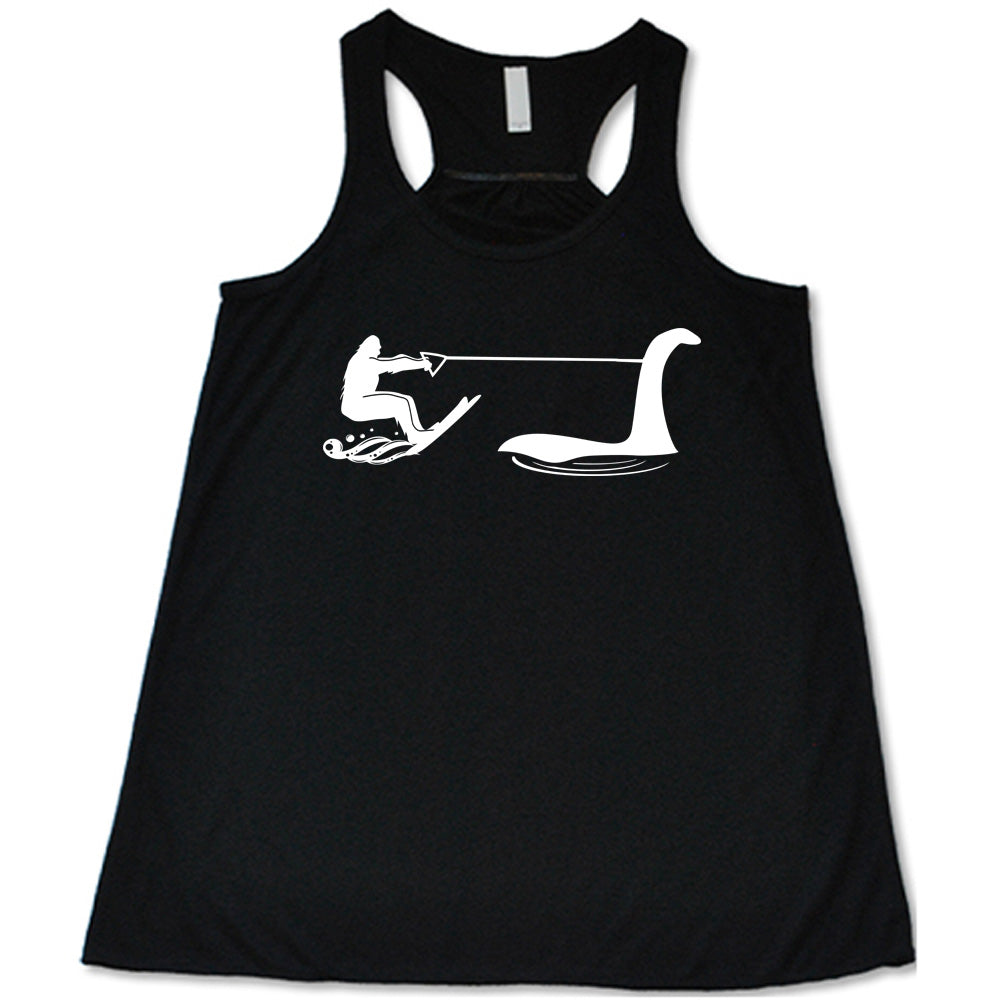 Black colored flowy tank with bigfoot wakeboarding with Nessie graphic on it