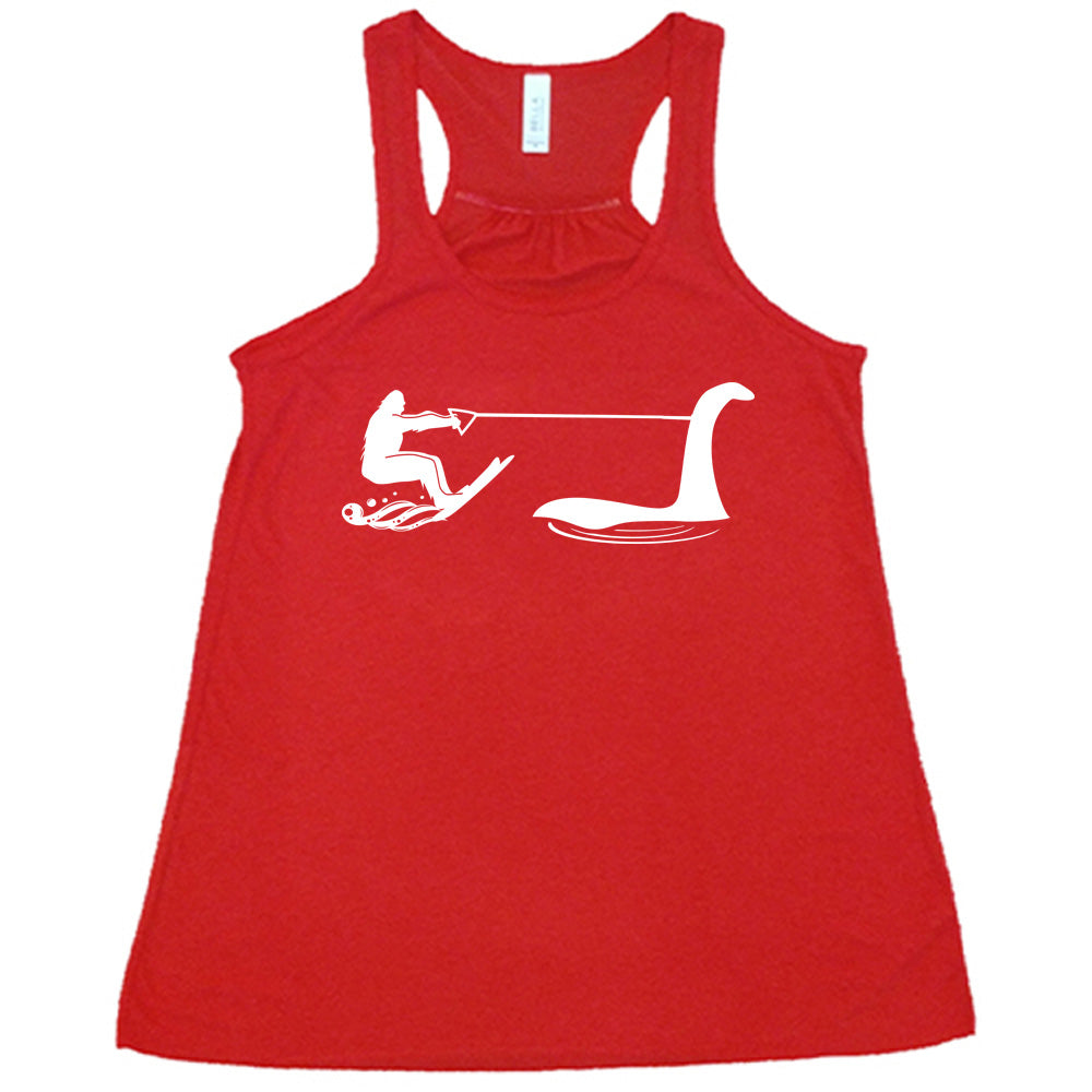 Red colored flowy tank with bigfoot wakeboarding with Nessie graphic on it