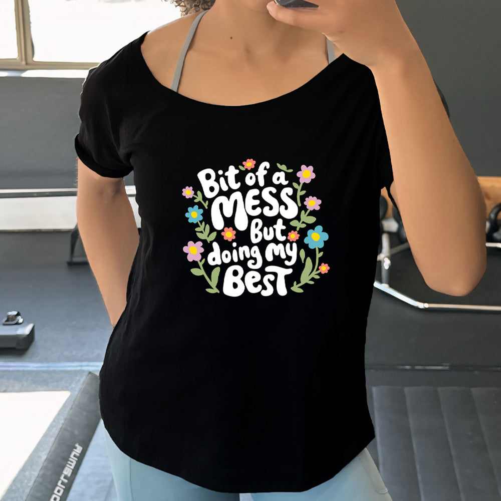 black slouchy shirt with the text "Bit of a Mess, But Doing My Best" on it
