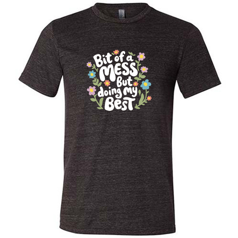 black shirt with the text "Bit of a Mess, But Doing My Best" on it