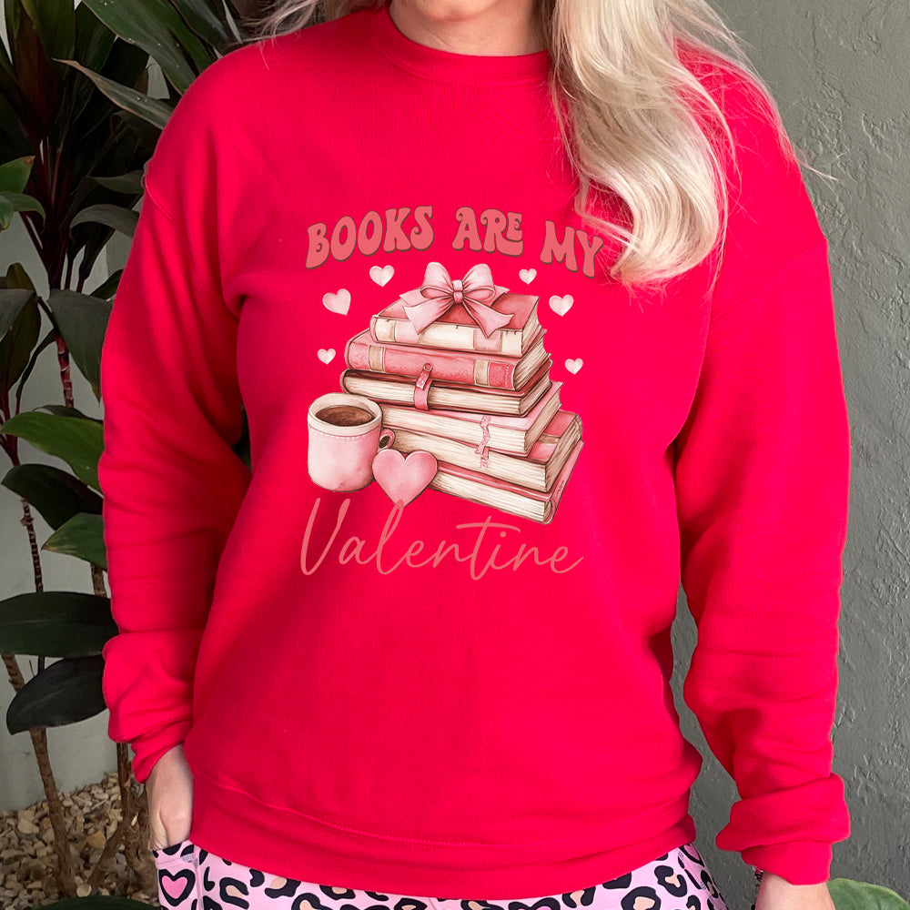 red crewneck with the text "Books Are My Valentine" on it