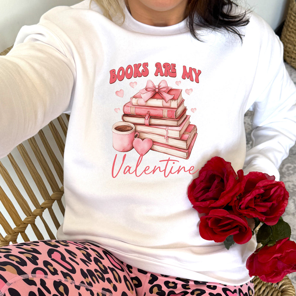 white crewneck with the text "Books Are My Valentine" on it