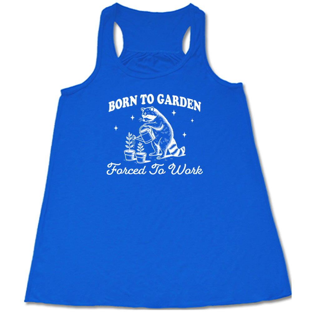 Blue colored flowy tank with a gardening raccoon graphic on it that says "Born to Garden, Forced to Work"
