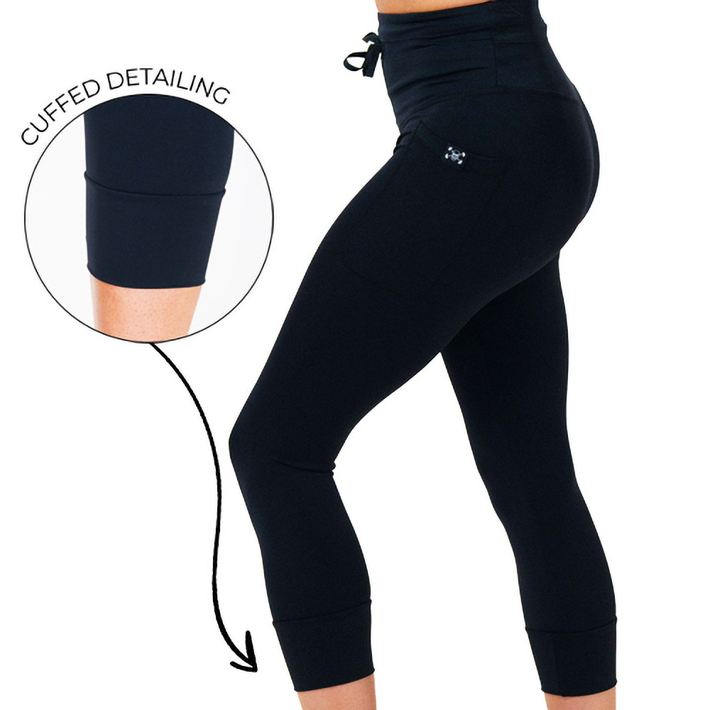 omni black leggings facing the side with a magnified snapshot showcasing the cuffed detailing against a white background