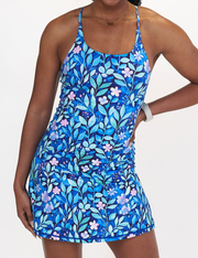 front of the blue flowers and vines limitless dress against a blue background