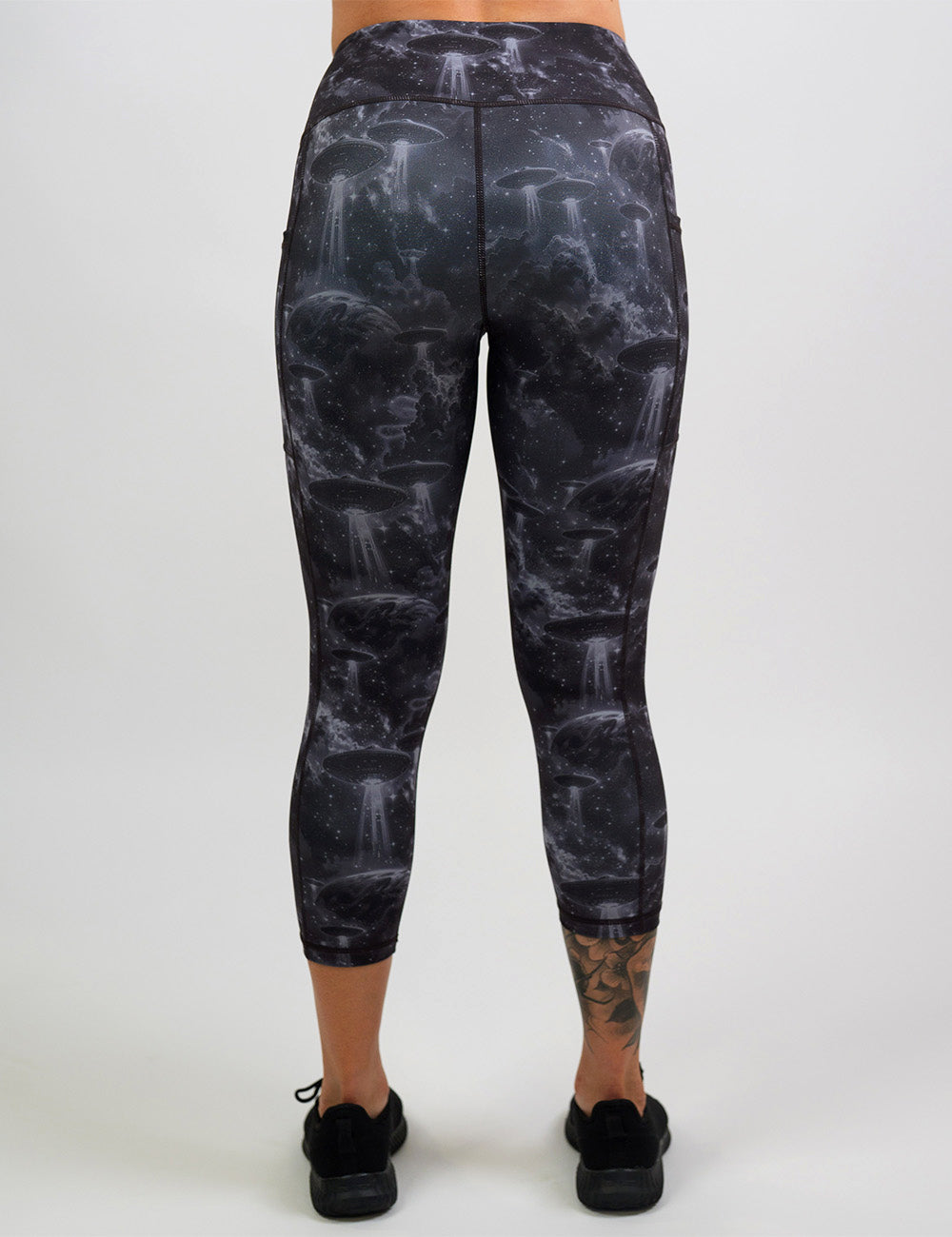 back of the alien space ship invasion capri leggings against a white background