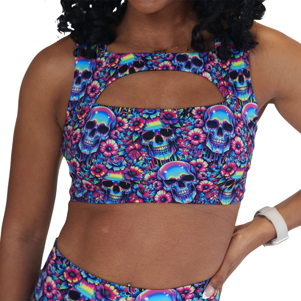 neon skull print sports bra against a white background