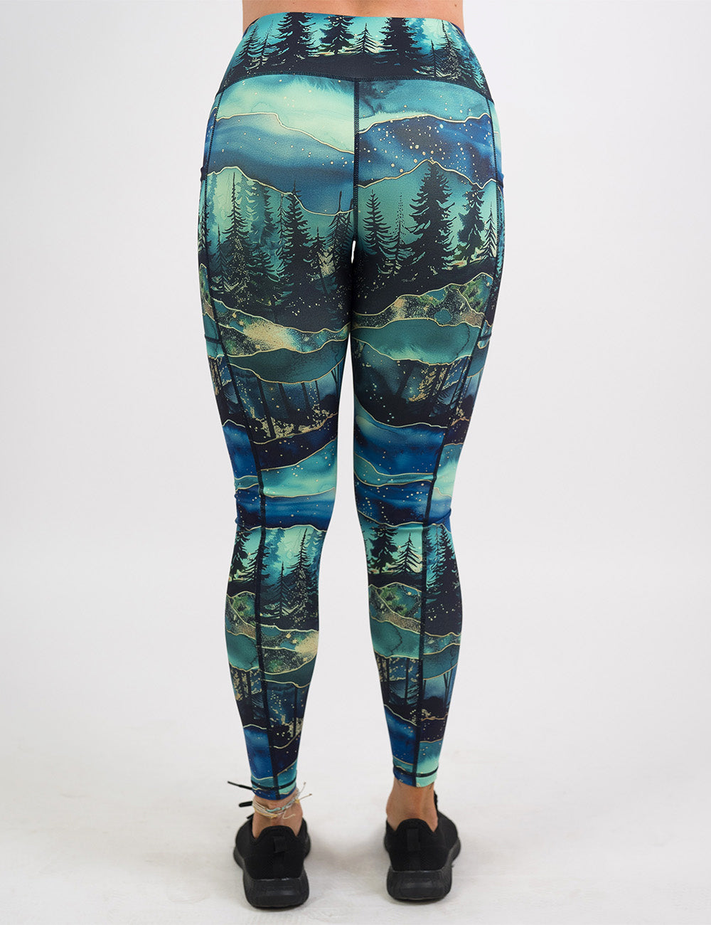 back of the full length aurora forest pattern leggings against a white background