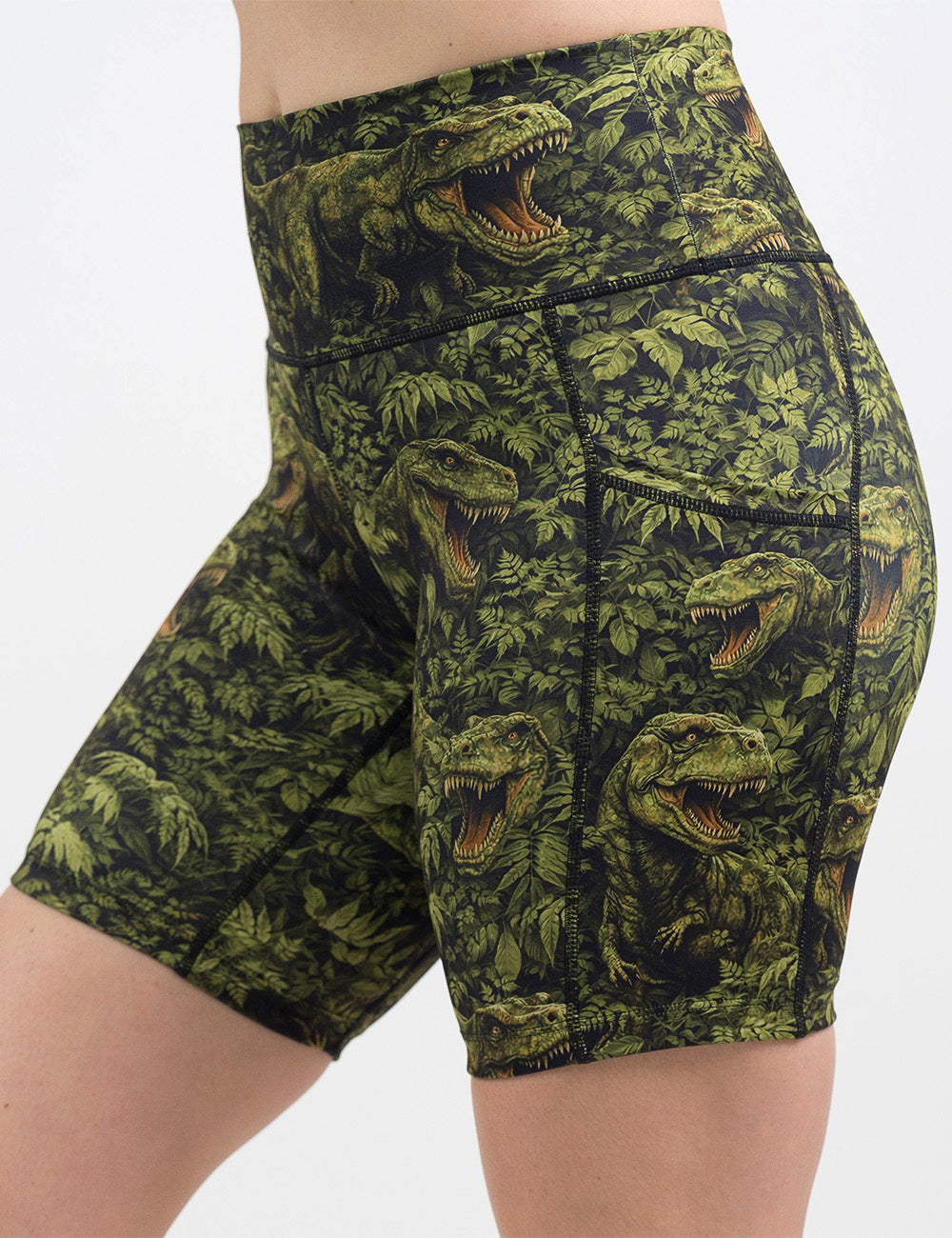 front of the 7 inch t-rex in a rainforest shorts against a white background
