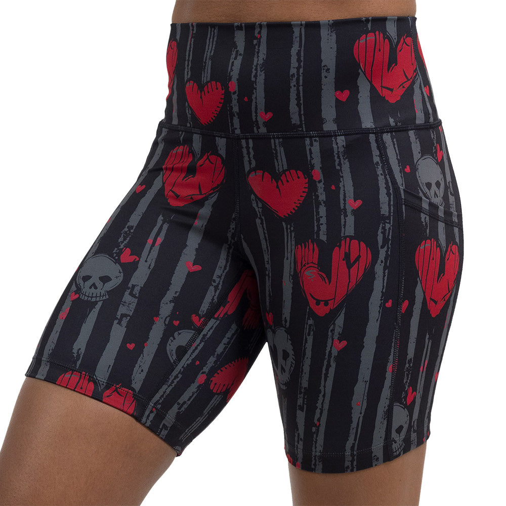 red heart and gray skulls against a black and grey striped background 7 inch short facing the front against a white background