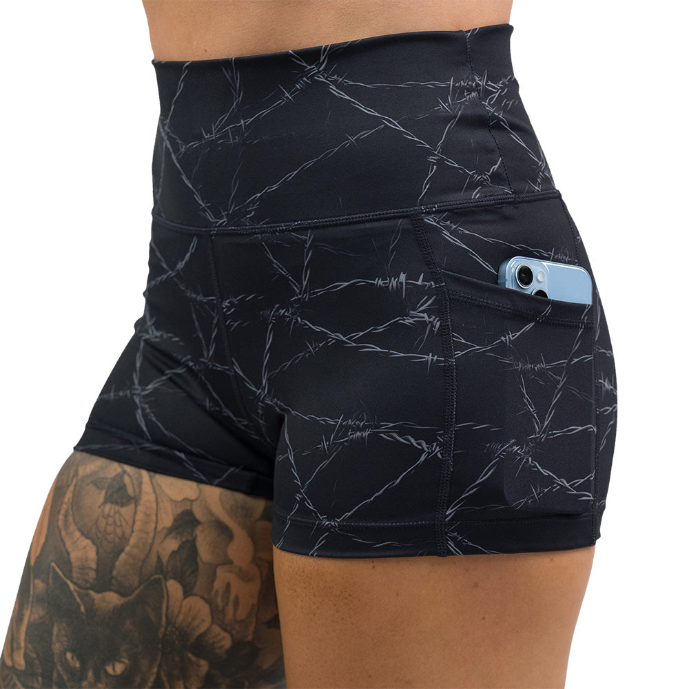 black shorts with a white barbed wire pattern on it
