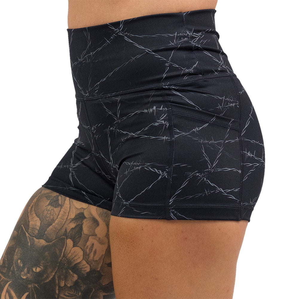 black shorts with a white barbed wire pattern on it