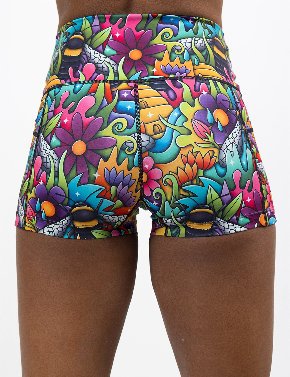 back of the cartoon bees against colorful cartoon flowers 2.5 inch shorts against a white background