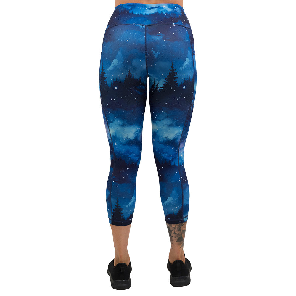 back of the blue sky and forest patterned leggings