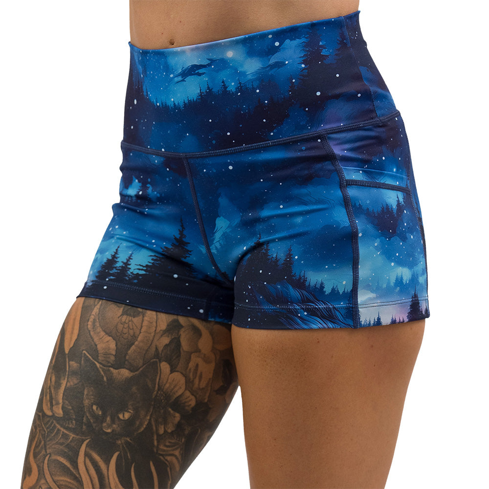 blue sky and forest patterned shorts