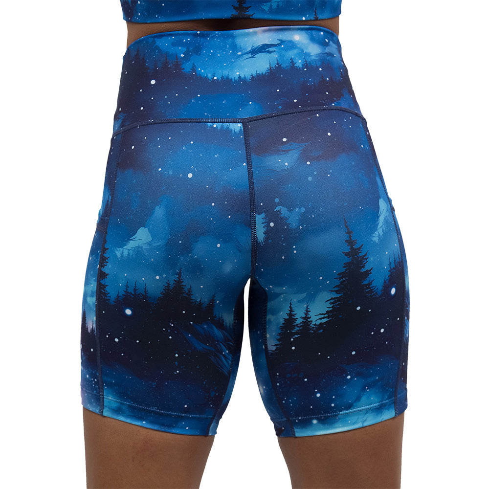 back of the blue sky and forest patterned shorts