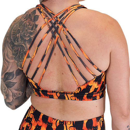 back of the black cats patterned sports bra