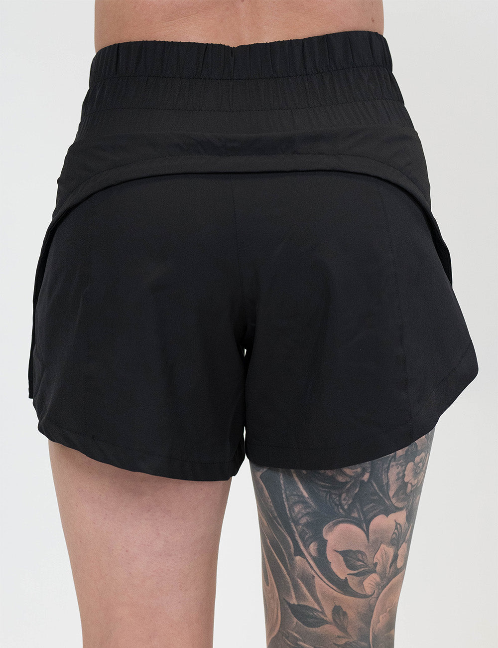 back of the 5.5 inch black day dream shorts against a white background
