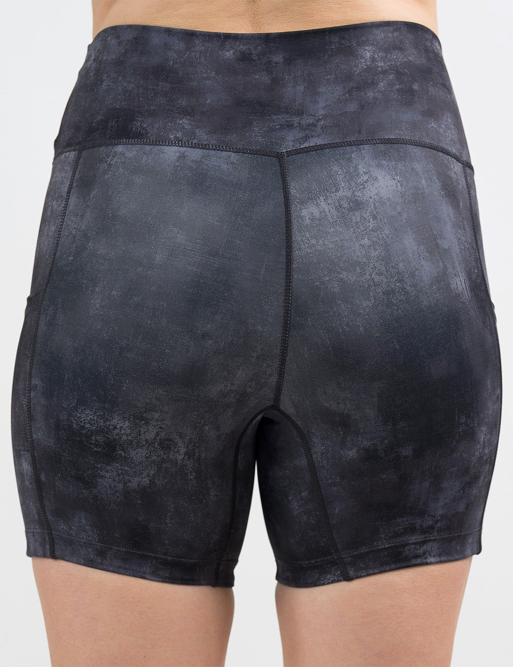 back of the black and grey grunge concrete pattern 5 inch shorts against a white background