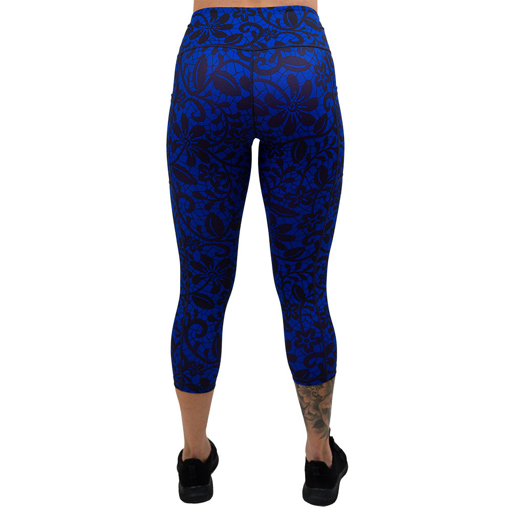 back of the black floral against a dark blue background capri legging
