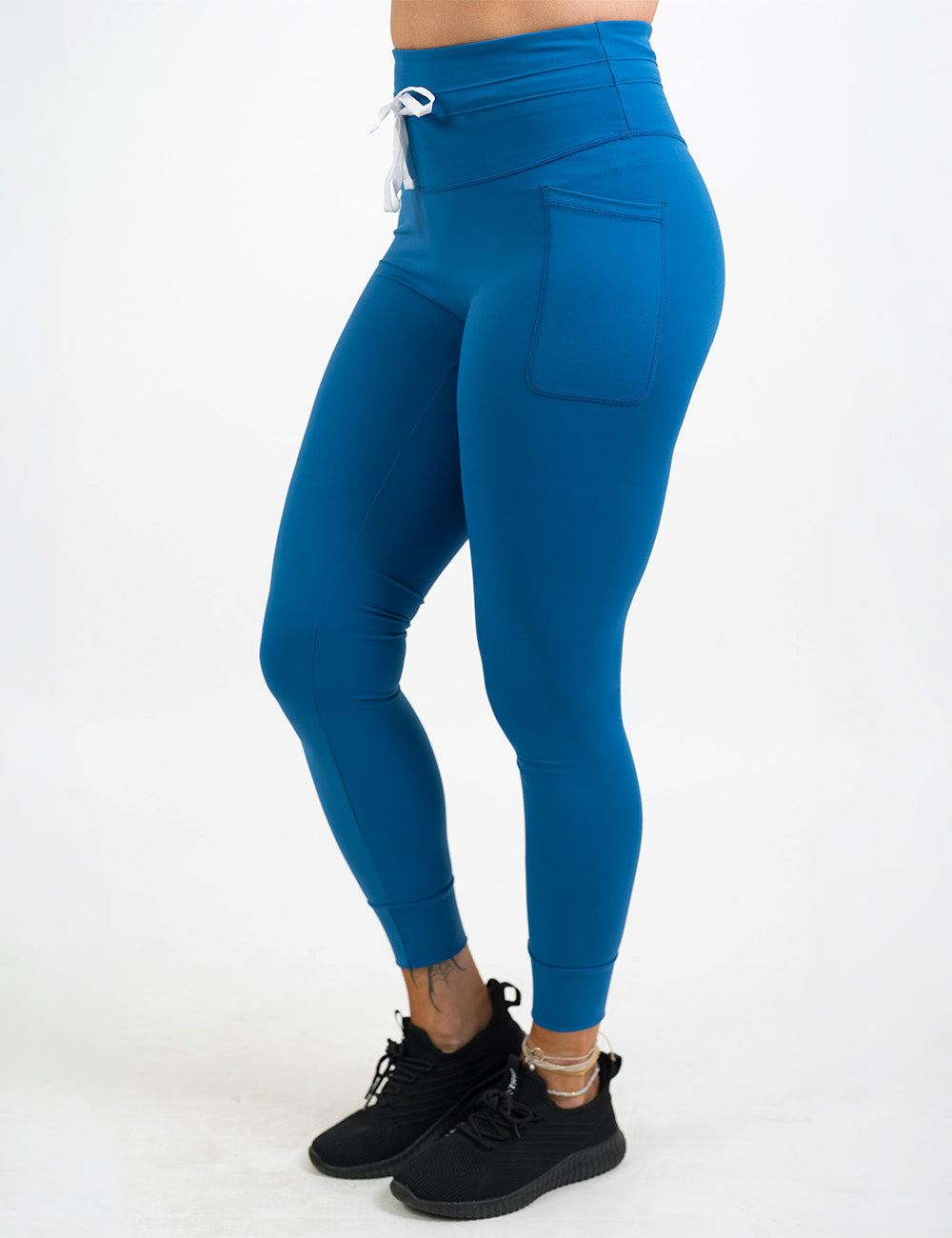 front of the blue omni style leggings with a white drawstring against a white background