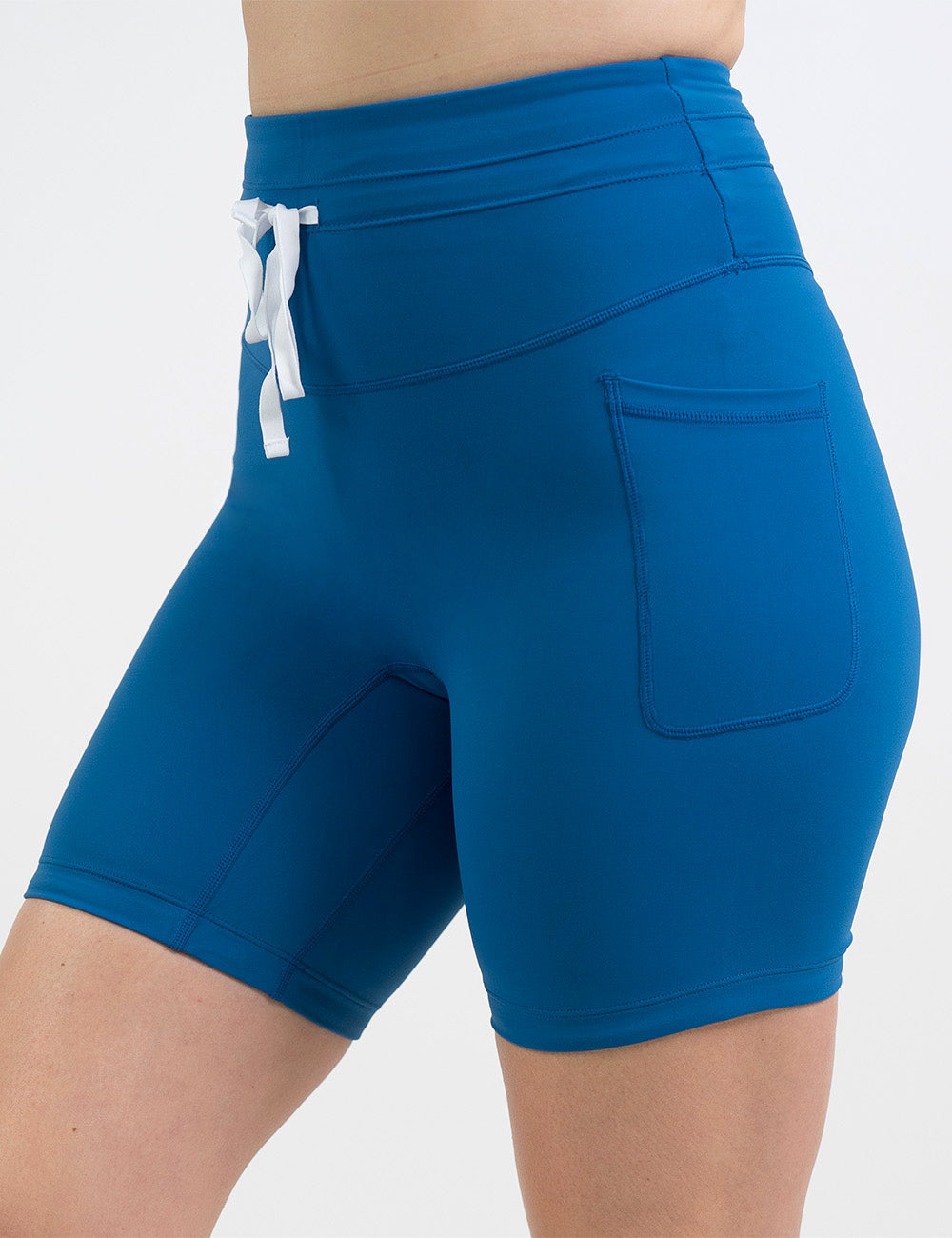 front of the 7 inch blue omni style shorts with white drawstrings against a white background