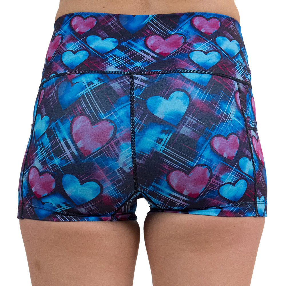back of the blue and pink hearts pattern against a dark stitched background 2.5 inch shorts