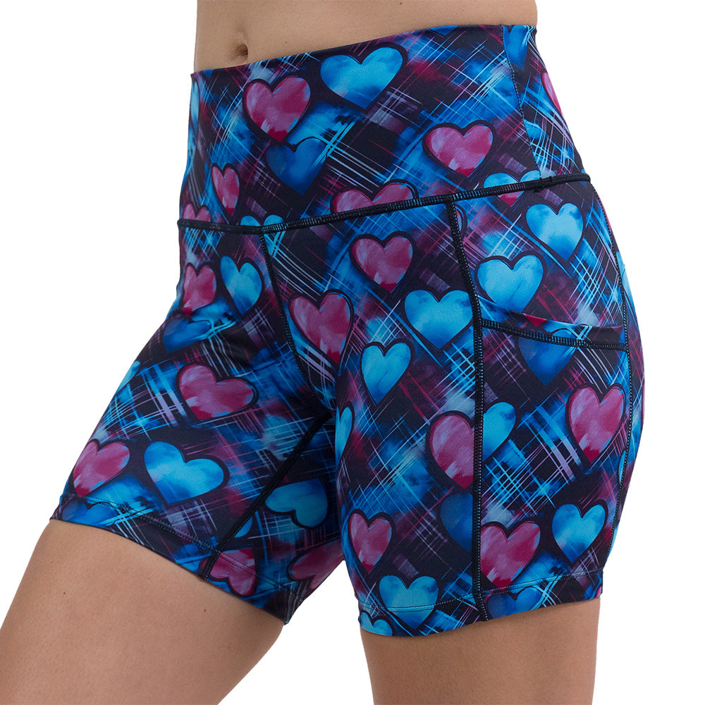 blue and pink hearts pattern against a dark stitched background 5 inch shorts facing the front against a white background