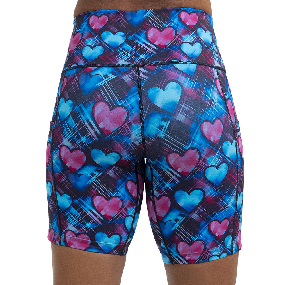 back of the blue and pink hearts pattern against a dark stitched background 7 inch shorts